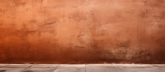 The brown wall on the street had a fascinating texture with a background texture that added depth and richness to its color. - obrazy, fototapety, plakaty