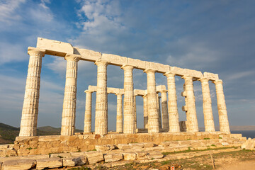 Obraz premium The Temple of Poseidon on Cape Sounion, Attica, Greece - ancient stone temple with Doric columns 