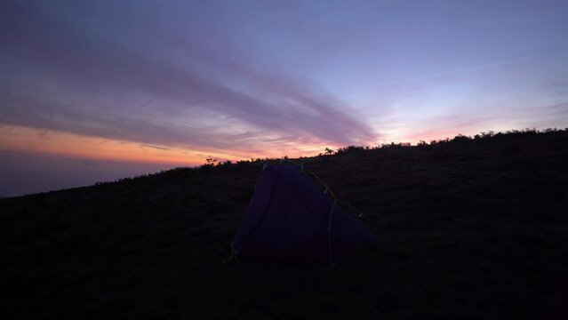 Time lapse of remote wild camping tent at sunrise in Northern Spain