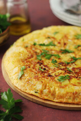 Frittata, traditional egg and potato omelette, Italian dish