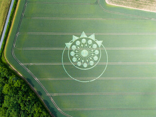 A crop circle, crop formation, or corn circle is a pattern created by flattening a crop. ...
