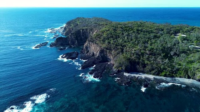 Drone aerial landscape Burrewarra Point headland cliff bushland trees walking track coastline rocky Guerilla Bay South Coast Tourism Batemans Bay NSW Australia 4K