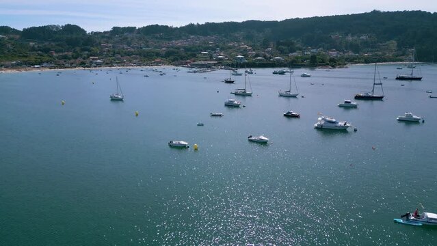 Drone footage of moored boats at the sea in the fishing port of Aldan in Pontevedra, Galicia, Spain