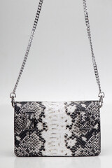 elegant and sophisticated women's handbag made of natural material on a light background
