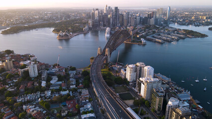 Aerial view of Sydney City, Sydney Harbour and the Harbour Bridge, NSW Australia on a sunny early morning in November 2023 