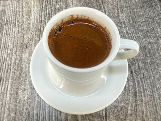 cup of Turkish or greek coffee on wooden table