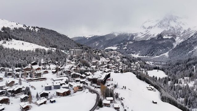 White and snowy aerial view of Arosa mountain town skiing resort, Switzerland
