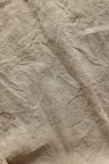 Beautiful beige fabric as background, top view