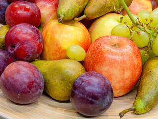 fruits plate with fresh grapes, pears, apples