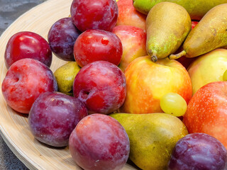 fruits plate with fresh grapes, pears, apples