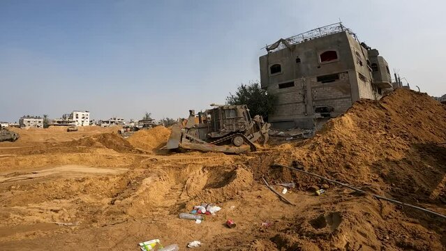 Israeli D9R Armoured Bulldozer makes roads and clears debris for ground offensive 