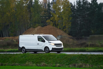 On the Delivery Route. Commercial Van Close-Up on the Road. Logistics branding. Commercial van on the road. Final destination shipping truck mock-up.