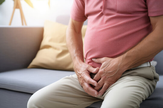 Man Suffering From Lower Abdominal Pain Or Prostatitis.