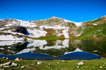 Fototapeta na wymiar Beautiful blue mountain lakes at high altitude. Beautiful mountain landscapes. Valley of lakes in the Kensu gorge in Kazakhstan. Almaty region. 