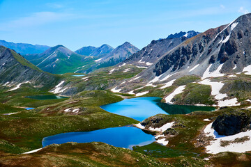 Beautiful blue mountain lakes at high altitude. 
Beautiful mountain landscapes. 
Valley of lakes in the Kensu gorge in Kazakhstan. Almaty region.
