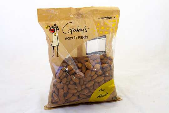 Johannesburg, South Africa - a bag of raw almonds from Gaby's Earth Foods isolated on a clear background with copy space
