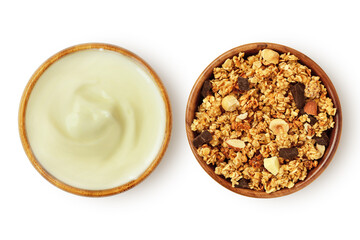 Yogurt and homemade granola in wooden bowl on white background