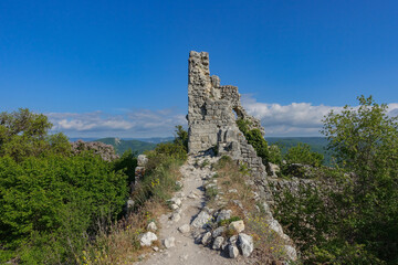 Fototapeta na wymiar Ancient buildings cave fortress city Mangup-Kale, sunny day. Mountain view from the ancient cave town of Mangup-Kale in the Republic of Crimea, Russia. Bakhchisarai.
