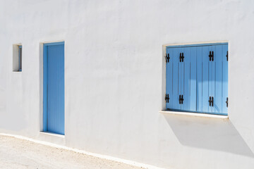 White walls and blue windows  and dooor in a property on one of the Greek islands