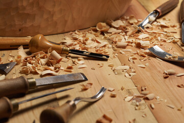 Wood carving tools. Carpenters hands use chisel. Senior wood carving professional during work. Man...