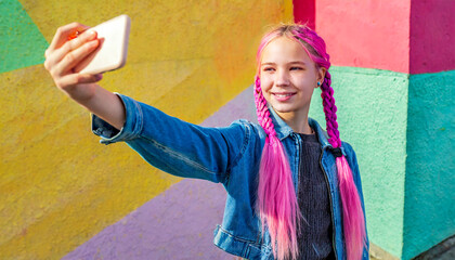 Teenage girl with pink hair taking a selfie against a grafitti wall, colourful, vibrant