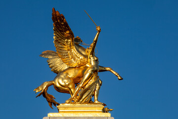 Statue on Alexander III bridge, Paris, France.