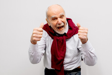 The hand of an elderly man shows a gesture of approval. Hand shows class gesture. Everything is...