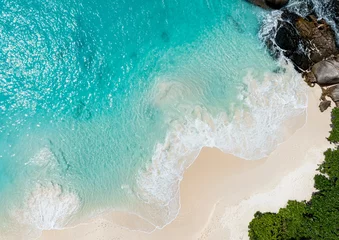 Foto op Aluminium Beach Wave water in the Tropical summer beach with  sandy beach background © SASITHORN