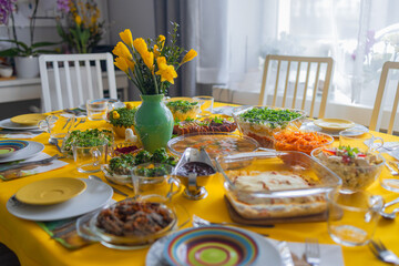 Traditional Polish Easter breakfast on a festive table with bright stylish decor and classic dishes...