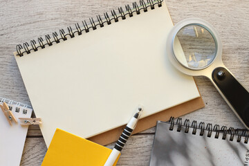 paper notepad, open page on wooden background