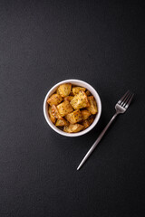 Delicious crispy fried potato wedges with salt, spices and herbs