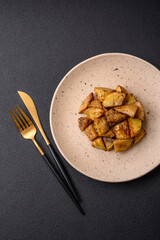 Delicious crispy fried potato wedges with salt, spices and herbs