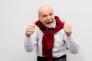 The hand of an elderly man shows a gesture of approval. Hand shows class gesture. Everything is...
