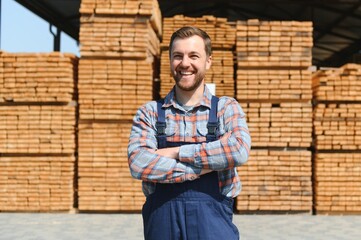 Joiner in uniform check boards on timber mill