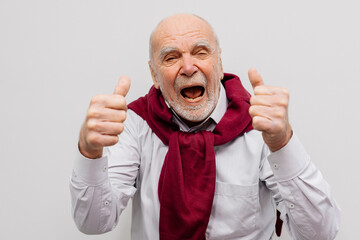 The hand of an elderly man shows a gesture of approval. Hand shows class gesture. Everything is...