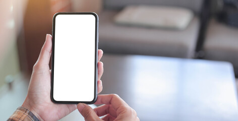 cell phone blank white screen mockup.hand holding texting using mobile on desk at office.background empty space for advertise.work people contact marketing business,technology