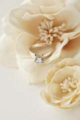 diamond engagement ring and flowers - 682235645