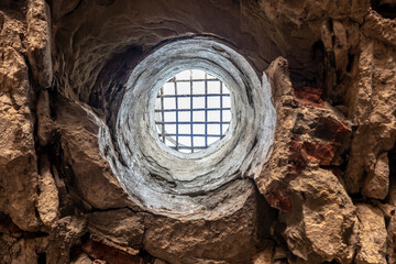 A hole with a grid as an overflow for rainwater from the castle courtyard to the castle entrance...