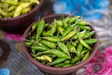 Chilies, Capsicum frutescens are eaten with fried tofu and tempeh or made into chili sauce as a...