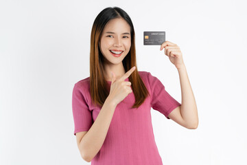 Smiling asian woman hand pointing finger at credit card on white background.