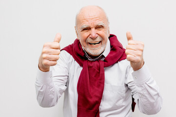 The hand of an elderly man shows a gesture of approval. Hand shows class gesture. Everything is...