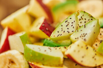 close up view of vegetarian salad with fresh fruits and honey with sesame seeds, culinary delight
