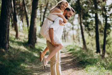 Young couple having a walk in the woods