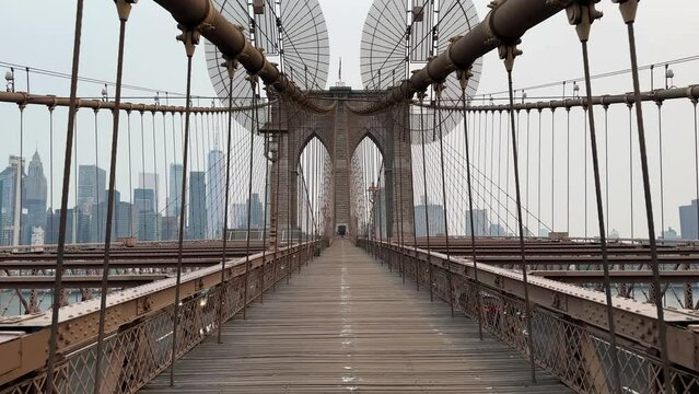 Walking on the empty Brooklyn Bridge in New York City, United States 