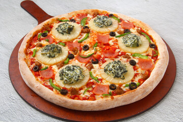 Freshly cooked Pizza with assorted toppings