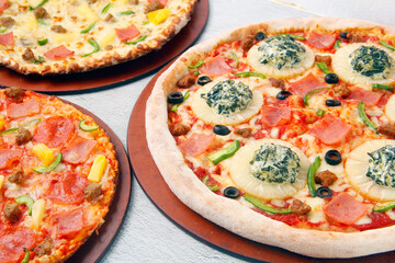 Freshly cooked Pizza with assorted toppings