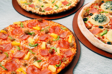 Freshly cooked Pizza with assorted toppings