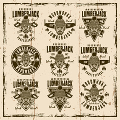 Fototapeta premium Lumberjack set of vector vintage emblems, labels, badges or prints on background with grunge textures