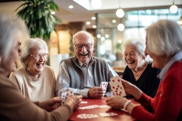 Happy joyful group of seniors playing cards - obrazy, fototapety, plakaty