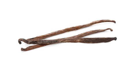 Many aromatic vanilla pods isolated on white, top view